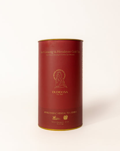 Red and gold DUDIDOSA tea tin labeled Red Ginseng & Himalayan Gold Tea. A luxurious herbal blend made with red ginseng, cordyceps, and maca. Crafted to naturally boost energy, balance hormones, and support desire.